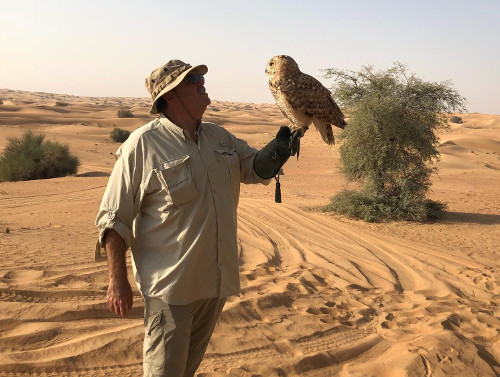 Me holding a desert eagle owl.