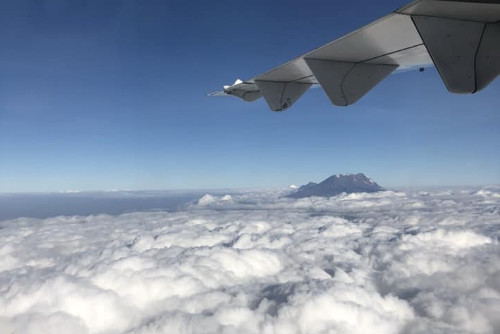Mount Kilimanjaro poking above the clouds as we flew into Tanzania.