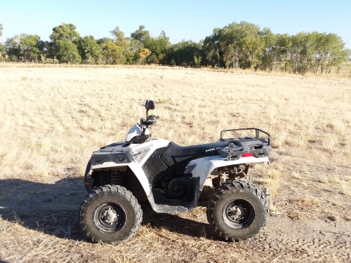 Our ATV is fun to ride on the ranch.