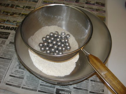 A sieve to separate the balls from the powder.