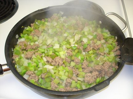 Cooking up the meat and vegetables.