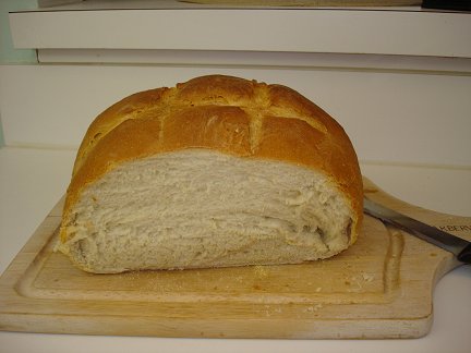 Slicing a loaf of my home-cooked Sourdough bread