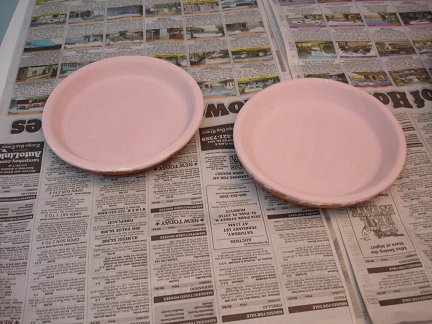 Two clay saucers used for melting the glass.