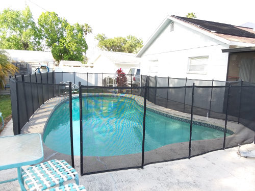 The fixed pool safety fence.