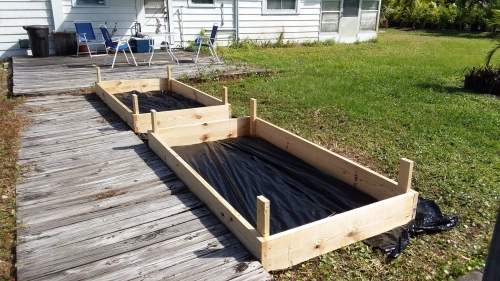 The raised bed garden boxes under construction.