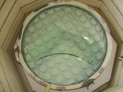 The mold with glass in the kiln.