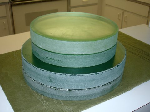 A stack of four telescope mirror blanks.