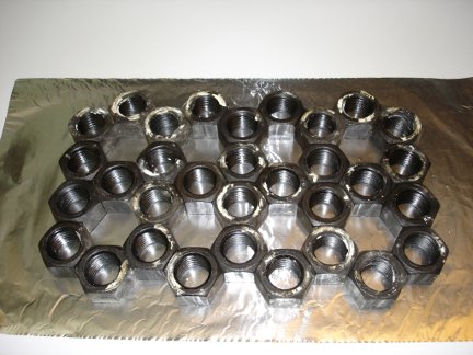 32 hex nuts in a pattern to make a mold.