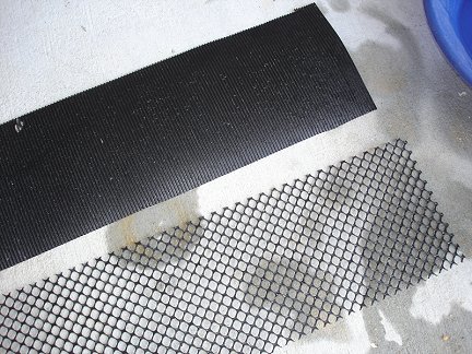 The ribbed rubber matting and the plastic mesh