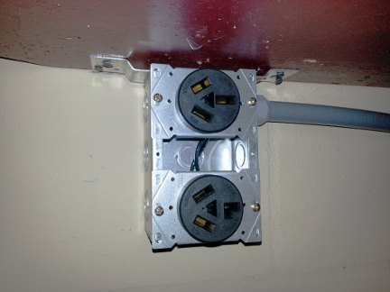 New outlets for the kilns installed in the garage.