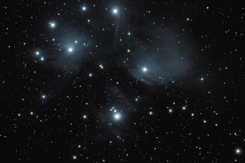 A photo of dust in the Pleiades star cluster.