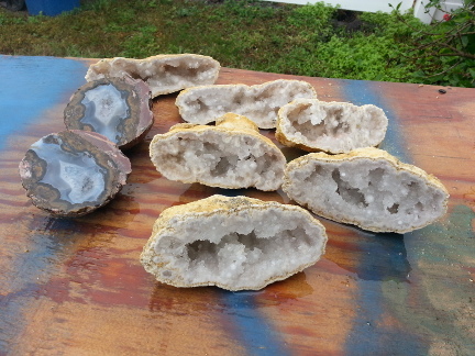 Four geodes cut open showing their insides.