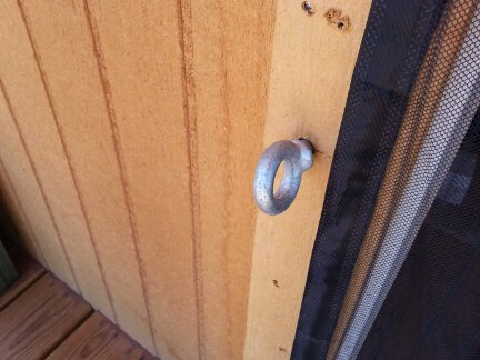 A close-up of one of the door eye bolts.